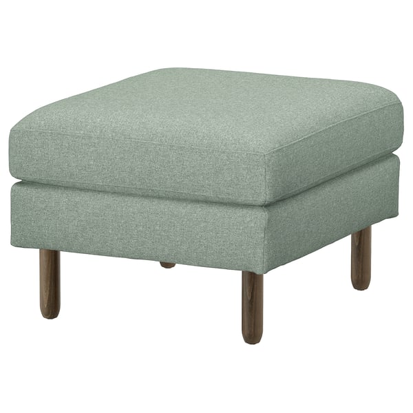 An IKEA SALTSJÖBADEN light green, square-shaped footstool. Its clean design includes a fabric-covered cushion atop solid wooden legs for support.