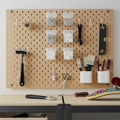 SKÅDIS pegboard in beige with tools & supplies. Plastic containers, hammer, wrench, level, brushes, scissors & more.