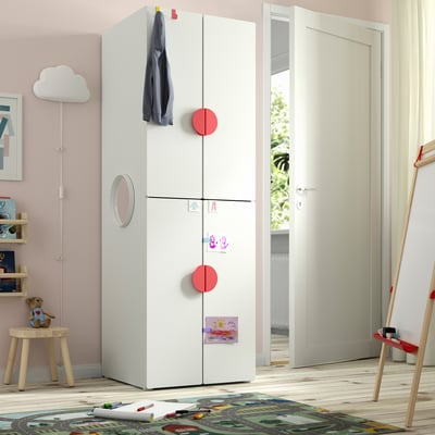 White SMÅSTAD wardrobe in childs room, tall with soft-closing doors.