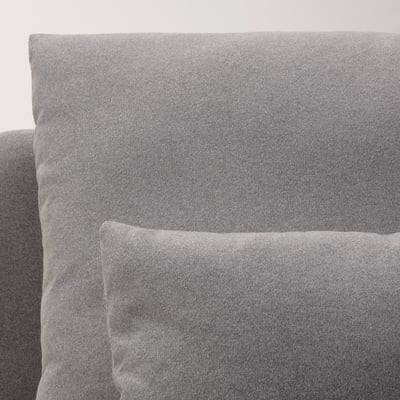 Close-up of a high-quality, soft, grey sofa cushion with a texture of recycled polyester fabric.