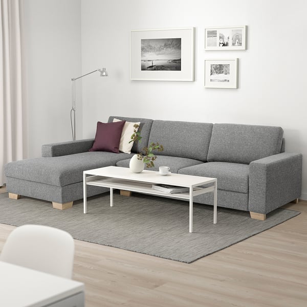 Modern grey SÖRVALLEN sofa, with white coffee table, roomy & minimalist.