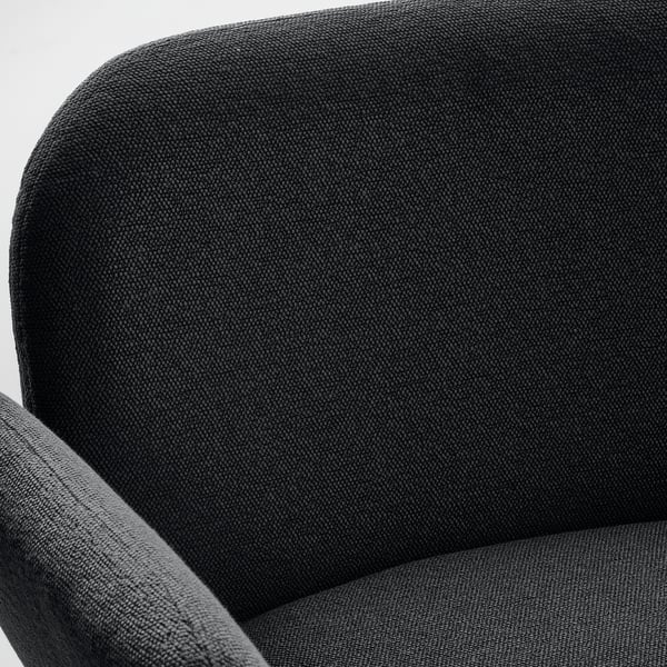 Close-up of SYNTORP stool, showcasing dark grey, textured fabric. High back and armrest visible, highlighting comfort and durability.