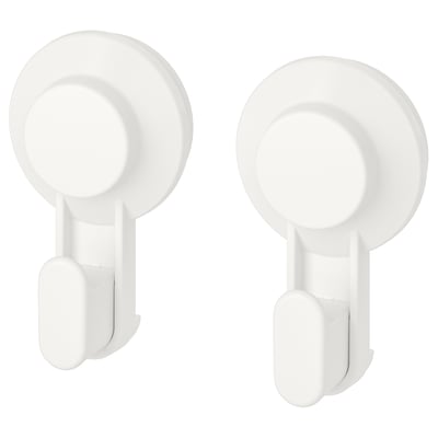 Two white TISKEN suction hooks, circular shape, wall-mounted, no-drill design.