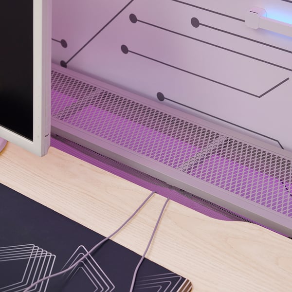 Gaming desk on wooden floor, showing sturdy metal mesh back, monitor cable management, and adjustable height settings.