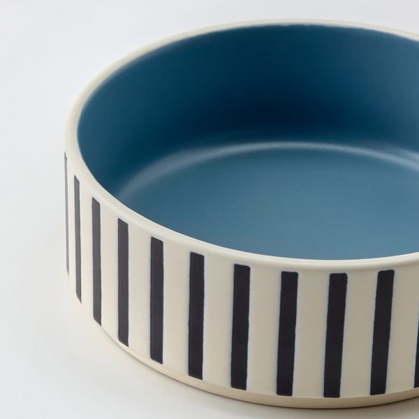 Modern, durable pet bowl with dark stripes and blue interior, made of sturdy stoneware.