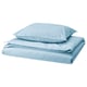 Ensemble de literie bleu - couette et taies d’oreiller en coton, doux et moderne.