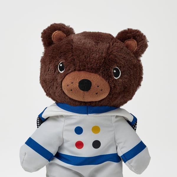 Ours en peluche en combinaison d’astronaute, de haute qualité, fourrure blanche, accents bleus, points multicolores, brodé.