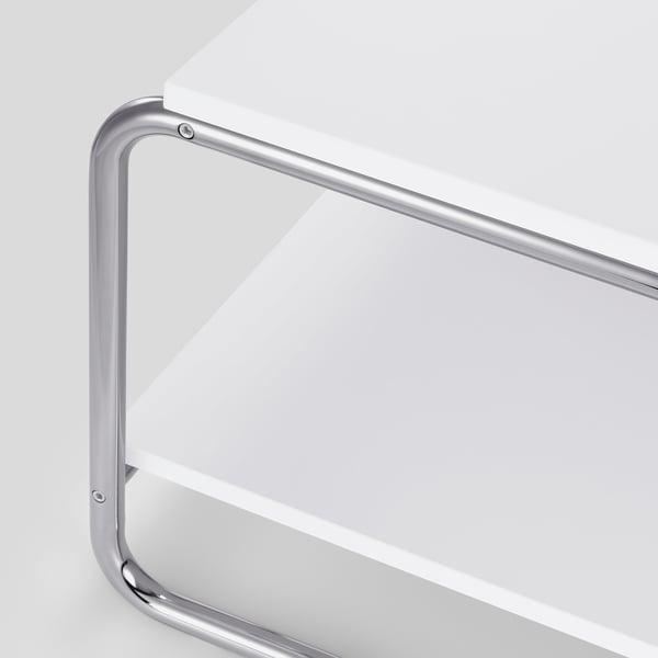 Table basse chromée moderne avec plateau blanc