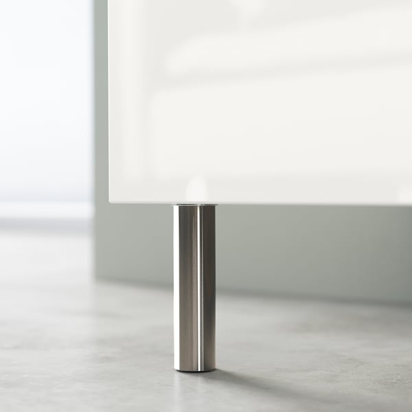 Meuble TV blanc moderne avec pieds chromés, design élégant et minimaliste.