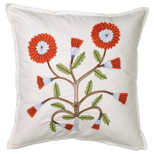 Coussin carré blanc avec des fleurs orange et bleues brodées à la main, des feuilles vertes, sur du coton doux.