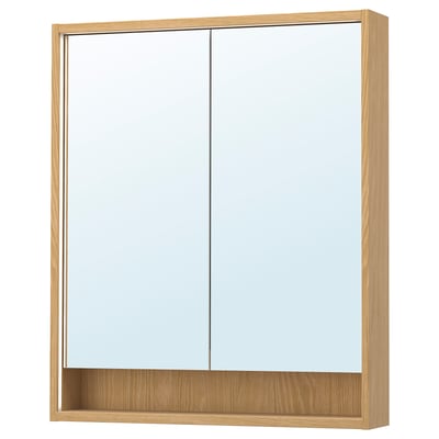 Une armoire de toilette en bois FAXÄLVEN avec éclairage intégré. Il est rectangulaire, brun clair, avec un design élégant et une étagère au fond.