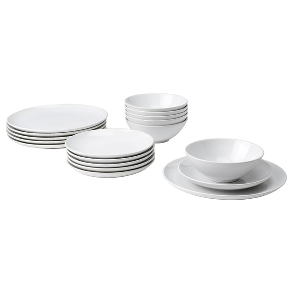 Piles d’assiettes et de bols blancs. Design simple et moderne. Matériau en grès émaillé. Convient pour un usage quotidien et les fêtes.