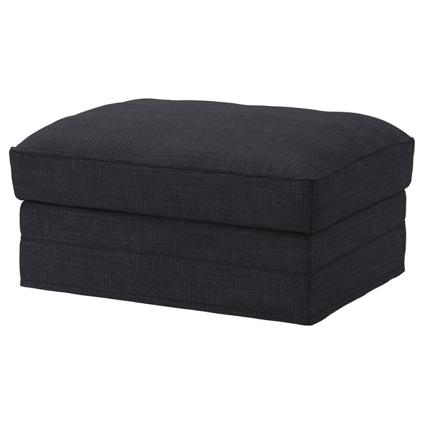 Un repose-pieds rembourré rectangulaire gris foncé au design lisse et épuré.