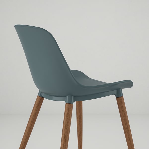 Une chaise moderne avec un siège bleu sarcelle confortable et incurvé et des pieds en bois robustes.