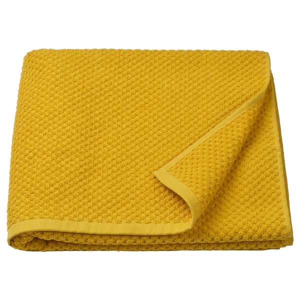 Serviette GULVIAL jaune vif, pliée, douce 100 % coton, épaisse, surface texturée.