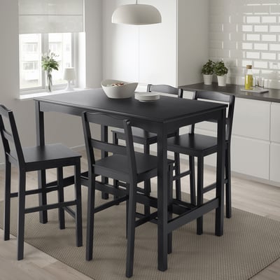 Ensemble de salle à manger noir avec table et 4 chaises, moderne et compact, matériau en pin.