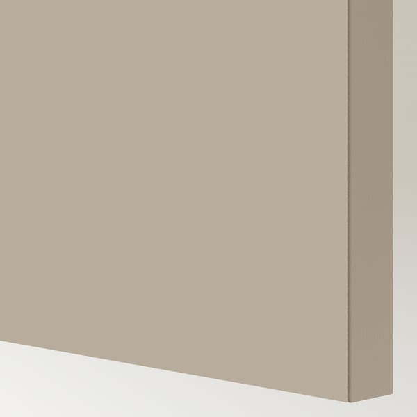 Gros plan de la porte coulissante beige de haute qualité avec une texture lisse, un design moderne et des bords nets.