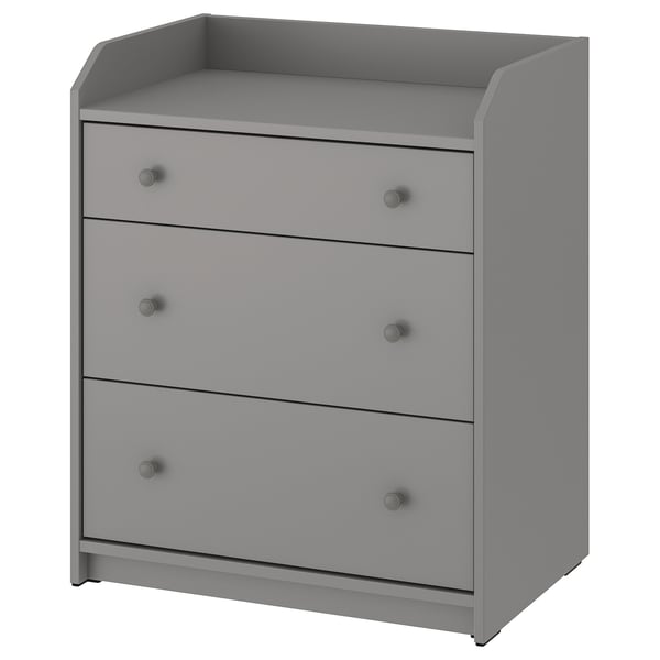 Commode grise HAUGA à 3 tiroirs avec boutons ronds.