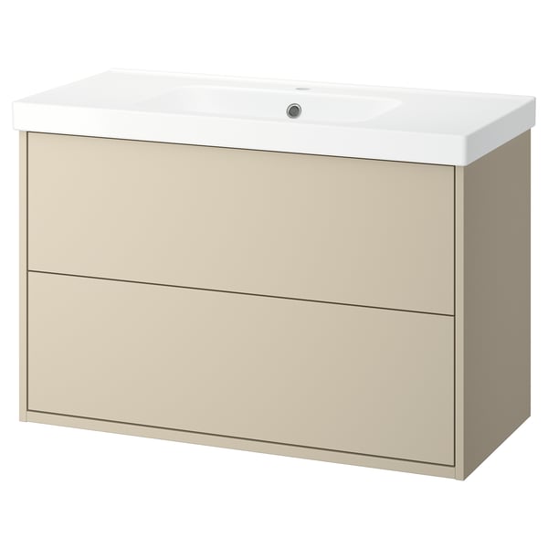Meuble de salle de bain HAVBÄCK beige avec 2 tiroirs, lavabo en céramique blanche, montable au mur.