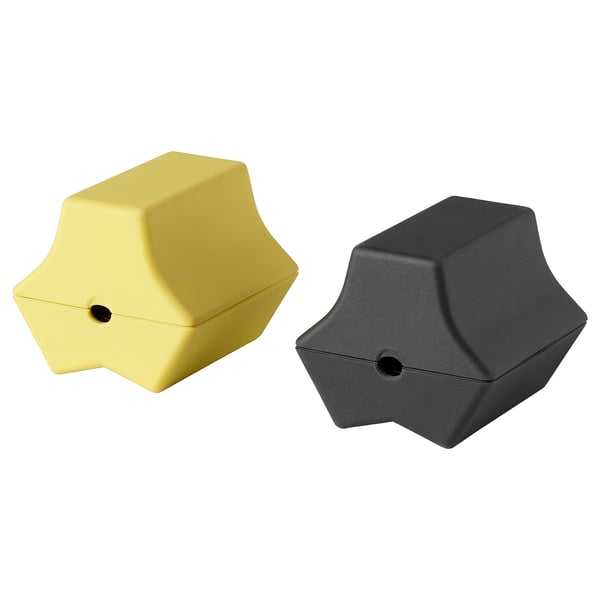 Deux organisateurs USB en forme d’étoile, l’un jaune, l’autre noir, avec de petits trous pour la gestion des câbles.