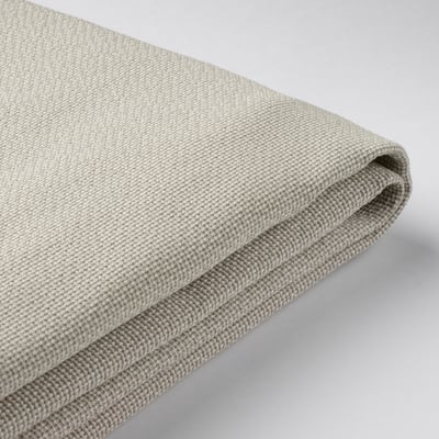 Tissu gris plié en gros plan, mettant en valeur la texture et la qualité de la housse HEMFJÄLLET.