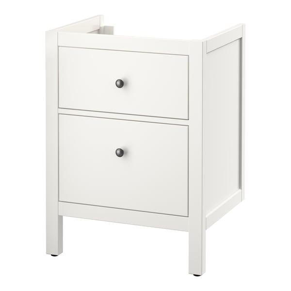 Un meuble vasque de salle de bain blanc ikea HEMNES avec deux tiroirs. Il a un design simple et classique avec des boutons noirs.