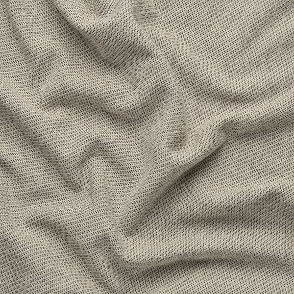 Gros plan d’un tissu doux et texturé avec des motifs subtils, probablement un matériau de canapé ou de rideau, mettant en valeur sa texture fine et son tissage de qualité.
