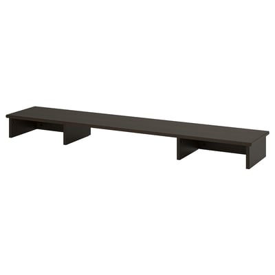 Un rehausseur de bureau en bois noir ikea IDANÄS. Il s’agit d’un design rectangulaire élégant avec deux zones de rangement latérales, idéal pour organiser les fournitures de bureau.