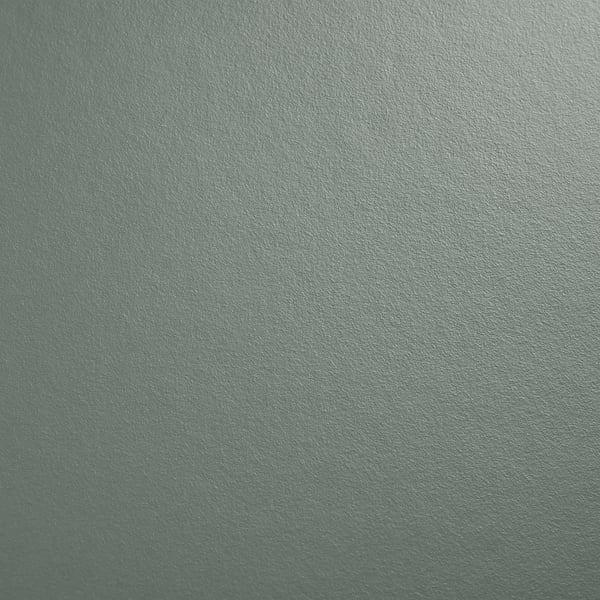 Surface sarcelle lisse, élégante et moderne, probablement un plan de travail en stratifié, mettant en valeur sa texture propre et bien entretenue.