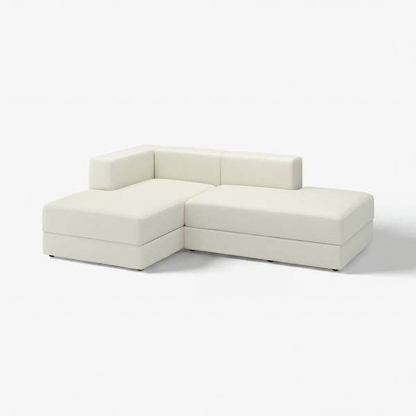 Canapé modulaire JÄTTEBO blanc avec deux chaises longues, avec des lignes épurées et des sièges profonds.
