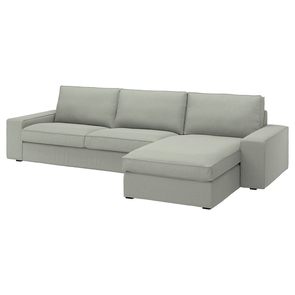Canapé moderne gris en forme de L avec des sections amovibles, des lignes épurées et des coussins moelleux.