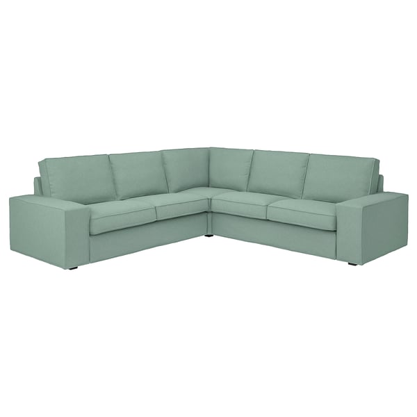 Canapé d’angle KIVIK : vert clair, design moderne avec accoudoirs bas, coussins moelleux pour plus de confort.