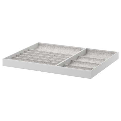 Plateau de rangement gris KOMPLEMENT, compartiments doublés de feutre pour les accessoires.