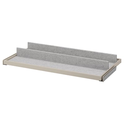 Une étagère à plateau coulissante grise KOMPLEMENT avec doublure en feutre, parfaite pour organiser les articles.