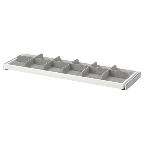 Un séparateur de tiroir gris et blanc KOMPLEMENT avec plusieurs compartiments pour organiser les petits objets.