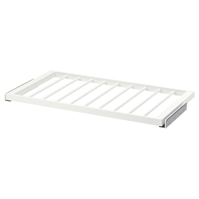 Cintre à pantalon KOMPLEMENT blanc avec conception grillagée pour un rangement organisé.