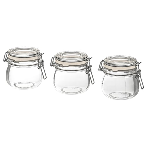 Trois bocaux KORKEN en verre transparent avec pinces métalliques et joints en caoutchouc, disposés en rangée.