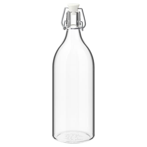 KORKEN : flacon en verre transparent avec pince en fil d’argent et bouchon blanc.