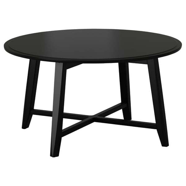 Table basse ronde KRAGSTA noire, finition peinture acrylique, bords lisses, quatre pieds inclinés.