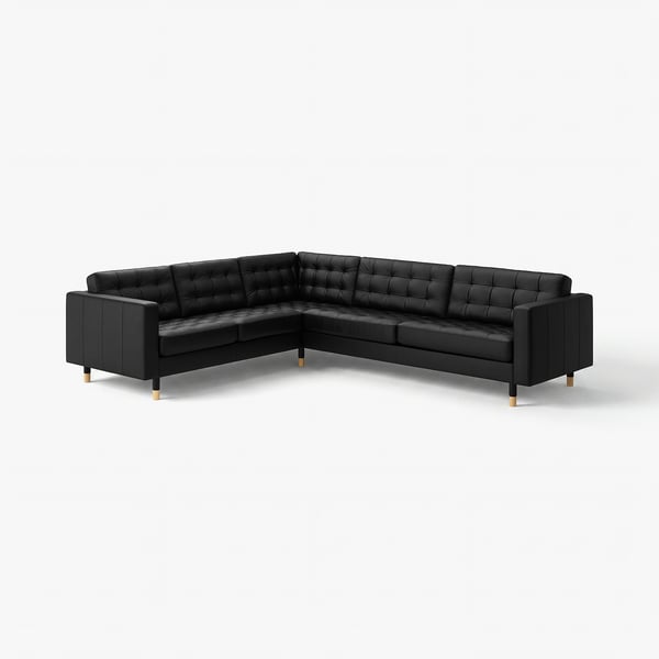 Canapé sectionnel en cuir noir en forme de L avec coussins tuffés et pieds en bois.