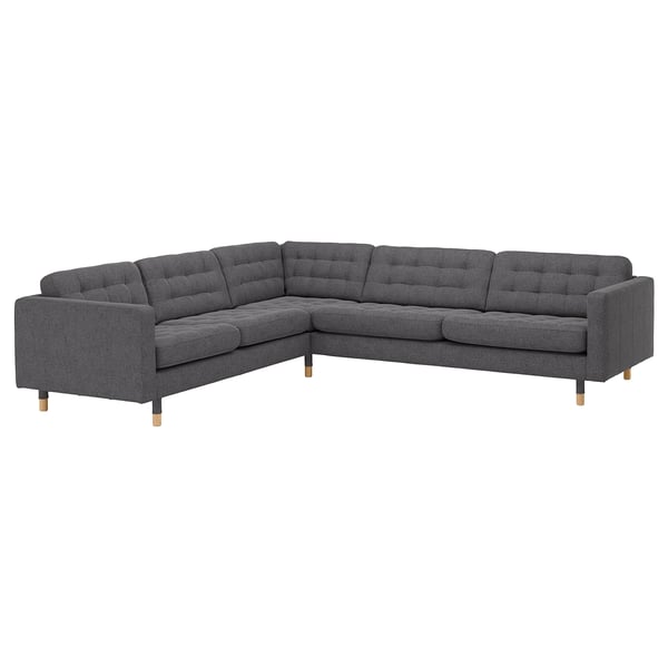 Un canapé sectionnel LANDSKRONA gris avec des coussins capitonnés, des pieds en chêne et un design moderne.