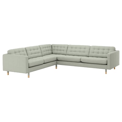 Un canapé sectionnel moderne en forme de L gris clair nommé LANDSKRONA avec des coussins capitonnés, des pieds en bois et une garantie de 5 ans.