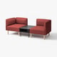 Ensemble canapé modulaire rouge, design moderne, avec pieds en bois et table d’appoint noire, adapté aux salons.