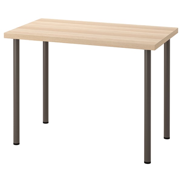 Une table LINNMON avec un plateau en bois de couleur claire et quatre pieds en métal foncé. Il est rectangulaire avec un design moderne.