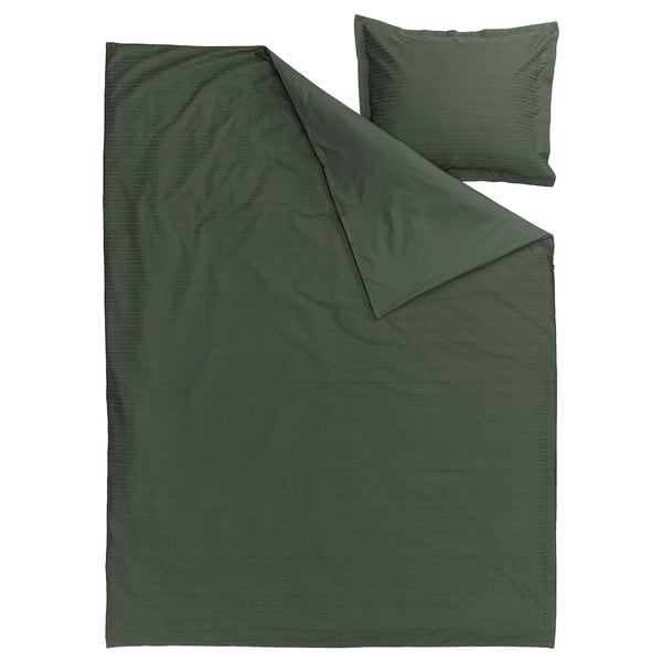 Ensemble de couette LUKTVICKER vert foncé, coton texturé en tissage gaufre, plat et plié pour l’exposition.