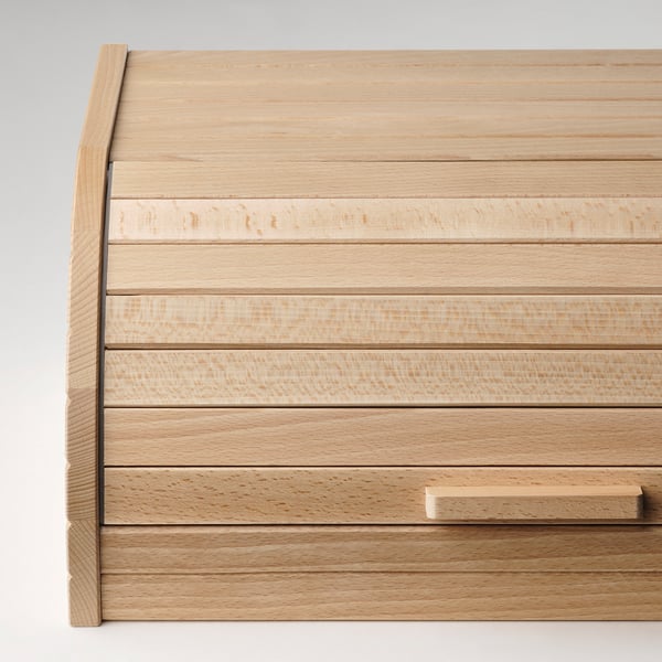 Meuble à tiroirs en bois avec une finition élégante et légère et des lignes épurées, idéal pour le rangement de la cuisine moderne.