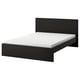 Lit MALM noir, design épuré, tête de lit haute, lignes épurées, style moderne.