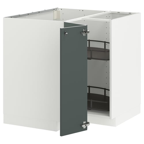 Une armoire de cuisine moderne gris-vert avec porte ouverte. Il fait partie du système METOD avec un cadre robuste et des étagères réglables.