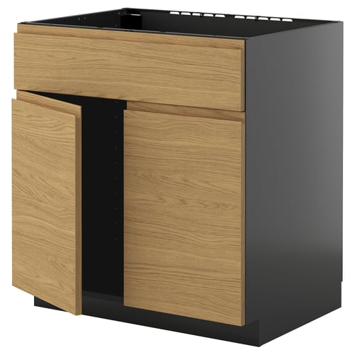 Meuble de cuisine METOD en chêne et noir au design minimaliste et poignées intégrées.