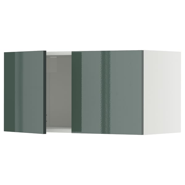 Un meuble de cuisine gris-vert brillant du système METOD.